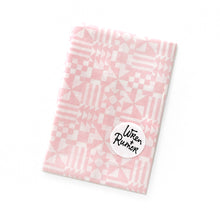 Load image into Gallery viewer, "Folded Pink geometric cotton scarf by Wren & Rumor with modern block print design – versatile fashion accessory or wall art"
