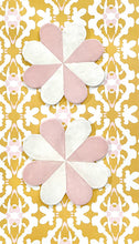 Load image into Gallery viewer, Pretty pink pinwheel pottery plates for hanging on the wall.