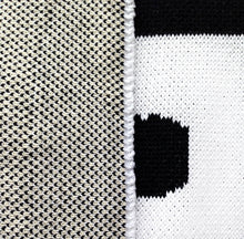 Load image into Gallery viewer, Modern reversible baby blanket in black and white knit pattern, gender-neutral nursery décor