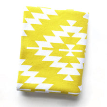 Load image into Gallery viewer, Folded yellow and white Aztec knit throw blanket, 50x60 inches, soft cotton blend, modern geometric pattern by Wren & Rumor.