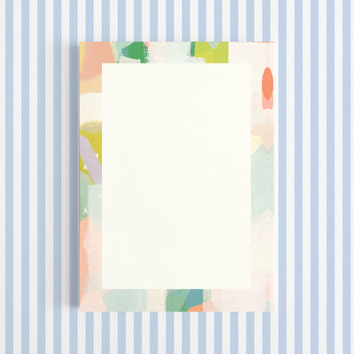 Colorful abstract patterned paper on a white background