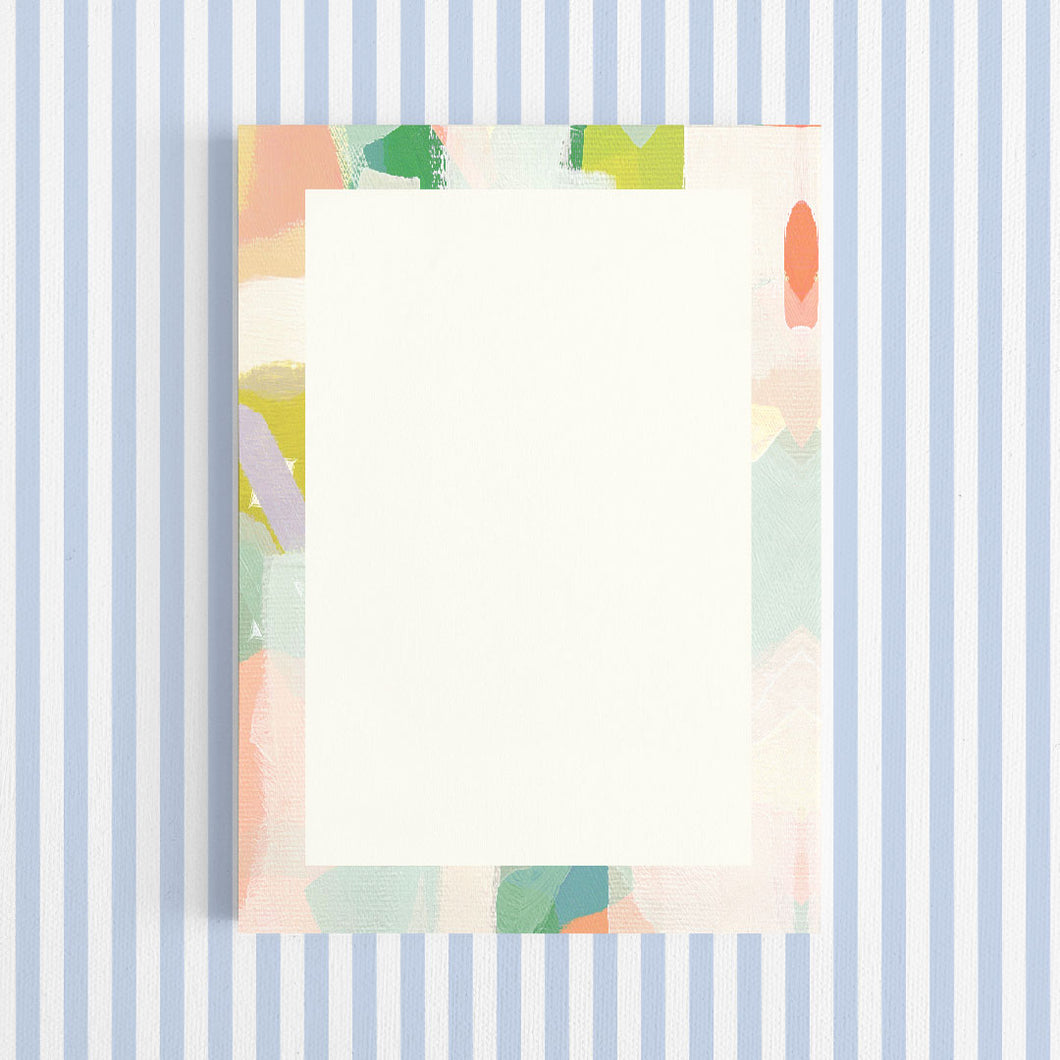 Colorful abstract patterned paper on a white background