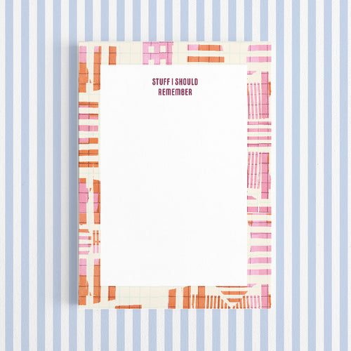 Notebook cover with colorful striped design and 'STUFF I SHOULD REMEMBER' text on a blue and white striped background.