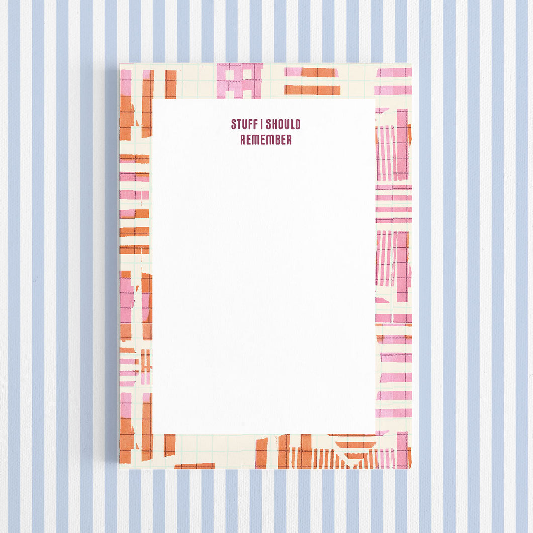 Notebook cover with colorful striped design and 'STUFF I SHOULD REMEMBER' text on a blue and white striped background.