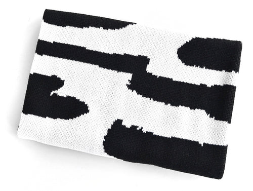 Reversible black and white knit baby blanket folded, modern abstract design by Wren & Rumor