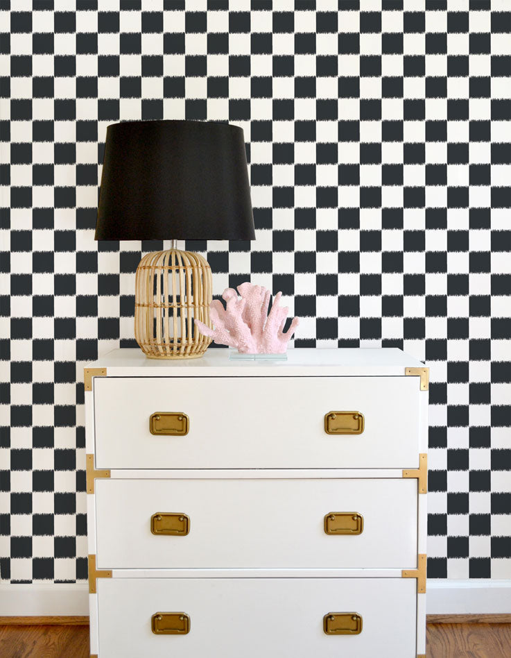 Navy and white ikat checker board wallpaper offered in peel and stick and traditional wallpapers. Perfect for a modern nursery, playroom, or kids bedroom.