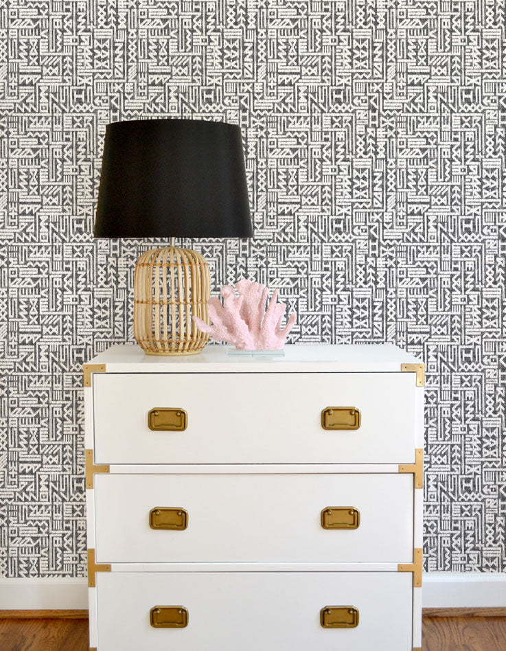 Navy blue and white geometric wallpaper with a coastal vibe offered in peel & stick and traditional wallpapers. Wall coverings designed for modern baby nursery, kids bedroom, and playrooms.
